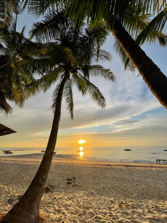 Tropical beach at sunset, suggesting rest and renewal